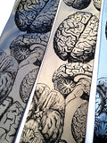 Anatomical brain ties. Black ink on silver, champagne, sky blue.
