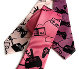 Video Game necktie: black on honeysuckle; black on orchid; black on ballet pink.