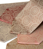 Warm cream ink on pale copper, dark salmon, salmon, peach, champagne, pale gold microfiber.