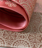 Warm cream ink on rose, cream, light pink microfiber.