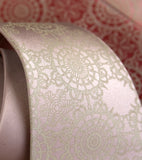 Warm cream ink on pale copper microfiber.