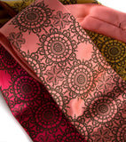 Chocolate brown ink on fuchsia, dark salmon, mustard microfiber.