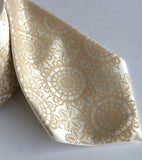 Warm cream ink on ivory silk.