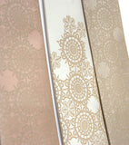 Warm cream ink on pale copper, ivory, champagne silk.