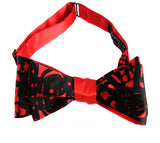 Black ink on a red bow tie.