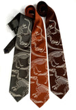 Dinosaur Bones neckties. Warm cream print on olive, cinnamon, dk brown microfiber.