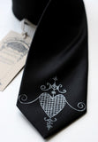 Silver ink on narrow black tie.