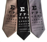 Eye Chart Necktie: black on mushroom; white on black; black on dark silver.