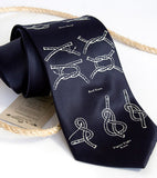Knot Tying Diagram tie. Ivory-cream on navy tie.