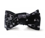 Pills bow tie: silver on black.