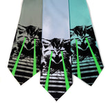 Laser Cat ties. Black and glow green on seafoam, sky blue, aqua.