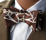 Tan ink on a brown bow tie.