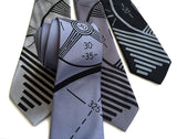 TV Test Pattern tie: black on steel; black on silver; black on dark silver; dove grey on black.