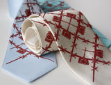 Crimson ink on cream, sky blue, aqua.