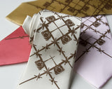 Bronze ink on ivory, rose pink, pale gold, lt pink.