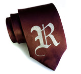 Cyberoptix Old English Blackletter initial necktie, antique brass ink on spiced wine.