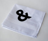  Black ink on white cotton handkerchief.