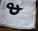  Black ink on white cotton handkerchief.