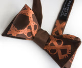 Copper ink on dark brown bow tie