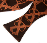 Copper ink on dark brown bow tie