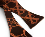 Copper ink on dark brown bow tie