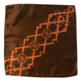 Copper ink on dark brown pocket square.