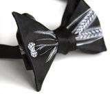 Beer bow tie. Pale grey on black.