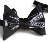 Beer bow tie. Pale grey on black.