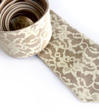Boudoir Lace print necktie, by Cyberoptix. Ivory-cream on champagne silk.