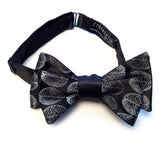 Dove grey ink on black bow tie.