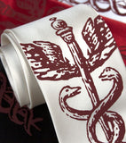 Crimson ink on white, black, red, cream