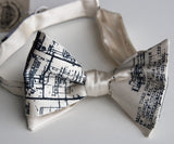 Navy ink on a cream bow tie.