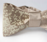 Ivory-cream ink on champagne bow tie