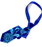 Chrysanthemum Necktie, Floral Print Tie by Cyberoptix. Turquoise on royal blue.