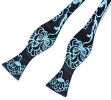 Turquoise ink on a navy bow tie