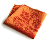 Damask pocket square: dark coral on carrot.