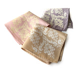 Damask pocket square: white on soft gold; ivory-cream on oyster; ivory-cream on ballet pink.