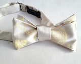 Diatoms bow tie. White ink on cream.