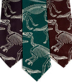 Dinosaur Bones neckties. Warm cream ink on charcoal, emerald, dark brown.