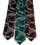 Dinosaur Bones neckties. Warm cream ink on charcoal, emerald, dark brown.