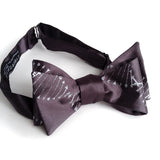 DNA bow tie: Silver print on charcoal.