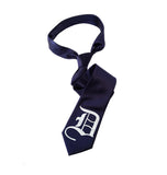 Old English D necktie: white on navy tie.