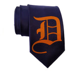 Old English D necktie: orange on navy tie.