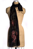 Rust ink on black silk scarf.