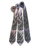 Fern leaf necktie: Black pearl on oyster; aluminum; steel.