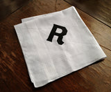  Black ink on white cotton handkerchief.