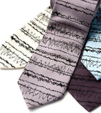 Insomnia Necktie: Black on cream, silver, charcoal, sky blue. Standard microfiber.