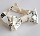 Cream knot tying diagram bow tie.