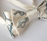 Cream knot tying diagram bow tie.