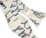 Cream knot tying diagram bow tie. Self-tie bow tie